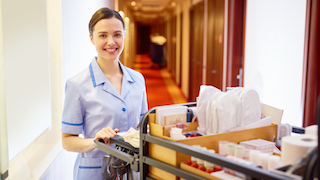 Young woman working as a hotel staff.