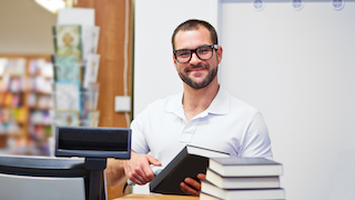 Student working part-time at the university bookstore.