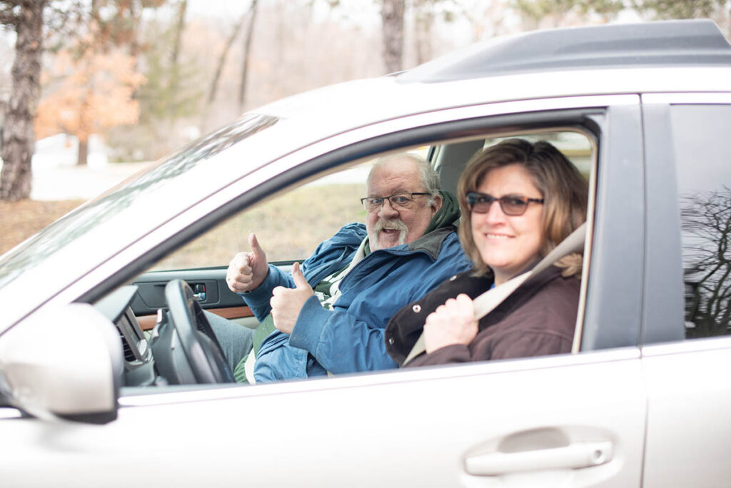 Papa Pal Kristin driving her senior companion Brian around to run errands.