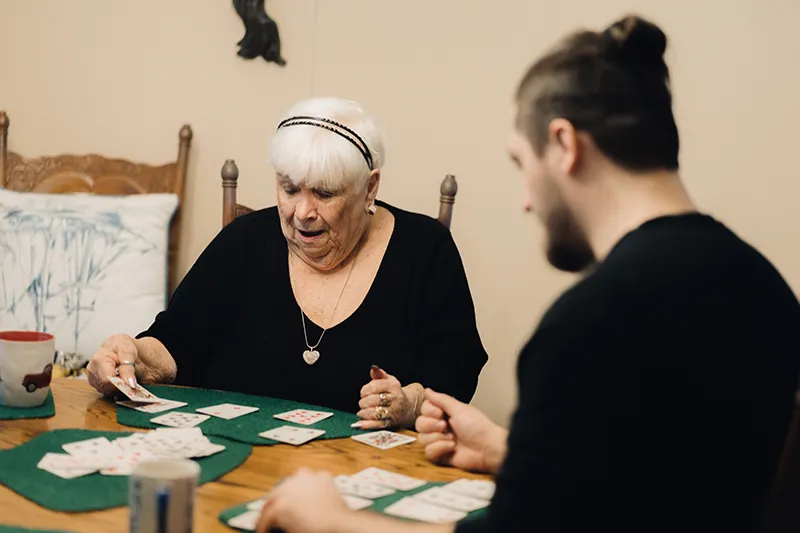 Claudette playing cards with Michael.