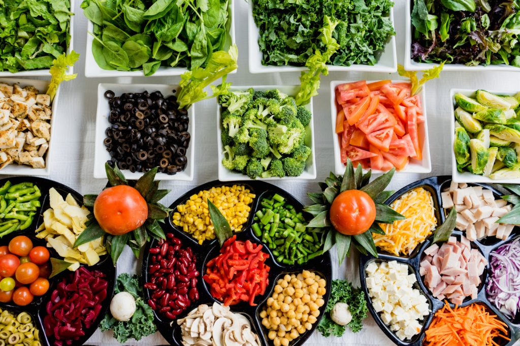 Salad bar shows nutrition and benefits of a good employee wellness program.