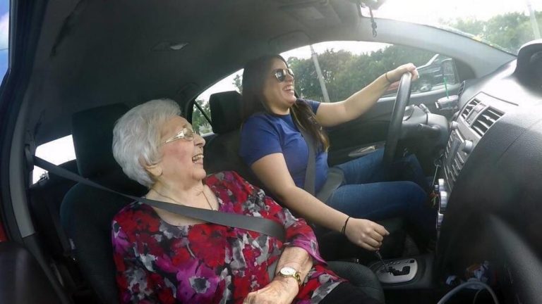 Papa Pal driving her senior companion around to run errands