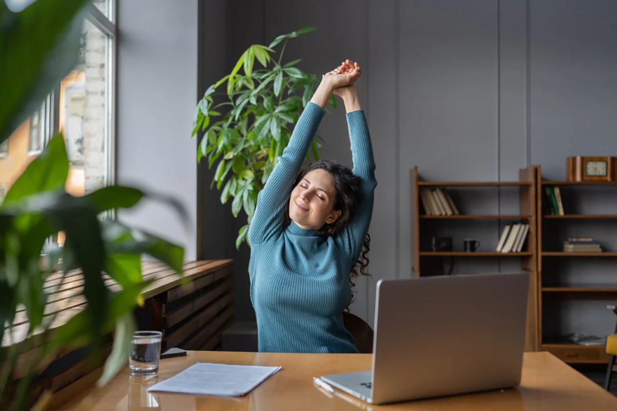 Woman stretching at work.