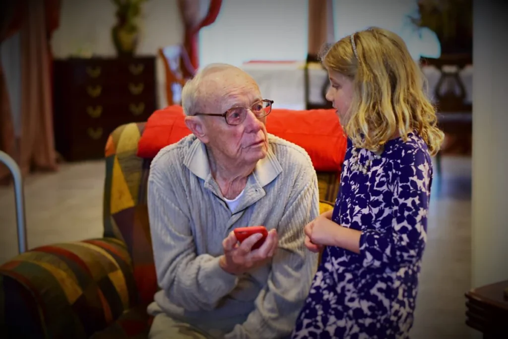 Senior speaking with his niece about home safety assessment.