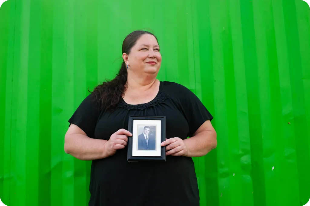 Michelle holding up a photo.