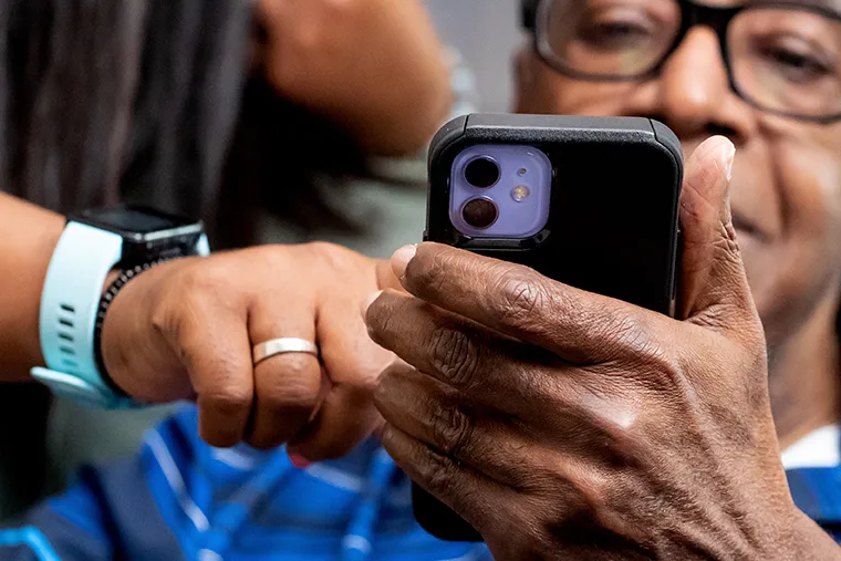 Senior man using his cellphone.