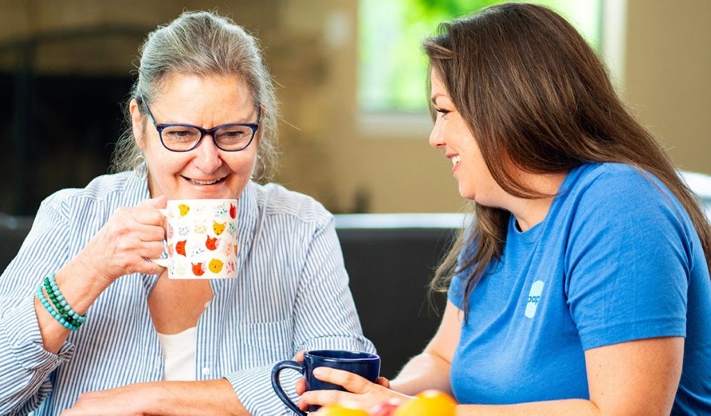 Member and Papa Pal talk over coffee