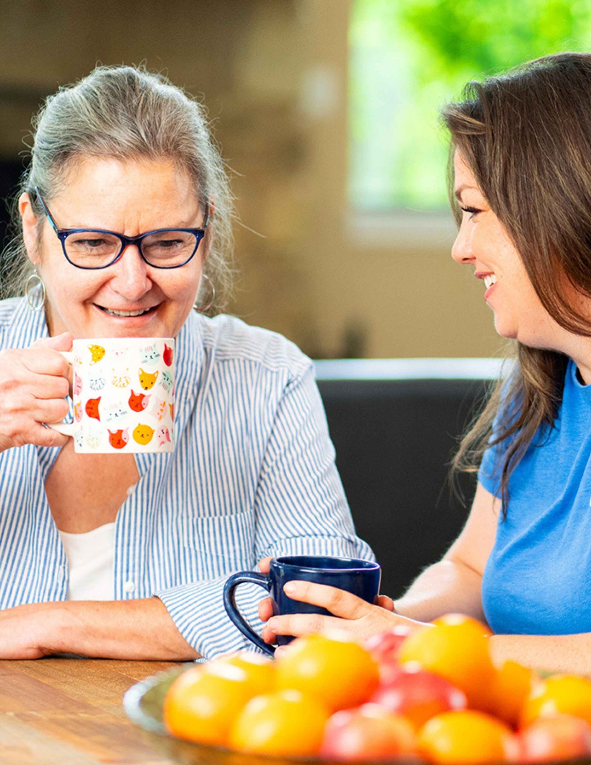 Member and Papa Pal chat over coffee